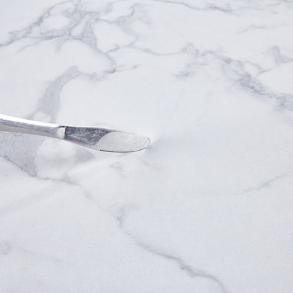Bread knife blade in stainless steel with serrated edge on marble surface on Tampa Home & Garden Store
