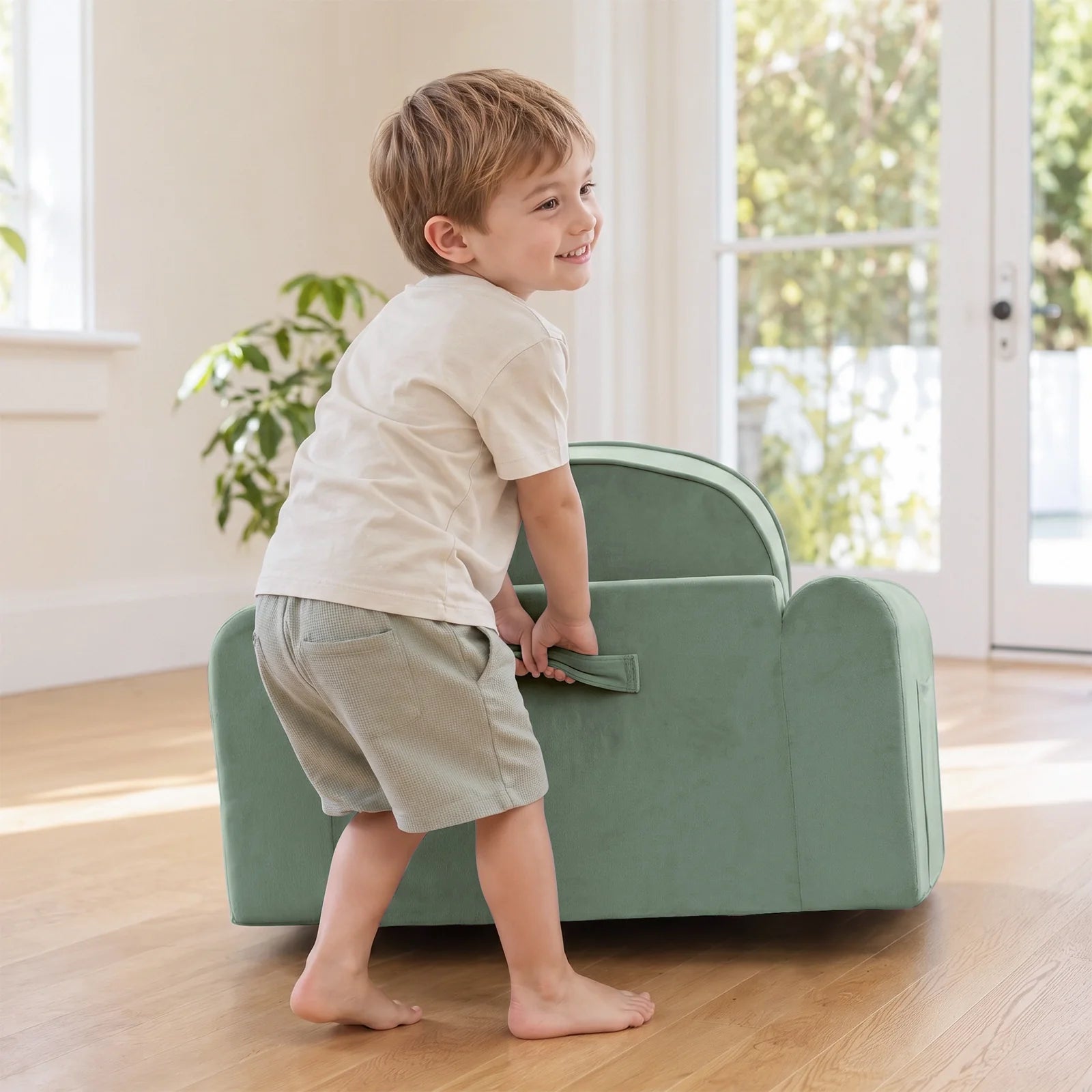 Tiny Land® GentleSnug Kids Sofa Chair sage green play chair with kid by doorway on Tampa Home & Garden Store