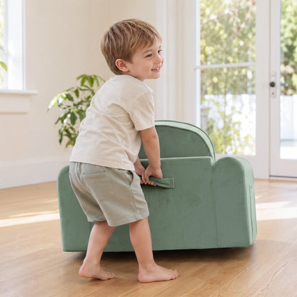 Tiny Land® GentleSnug Kids Sofa Chair sage green play chair with kid by doorway on Tampa Home & Garden Store