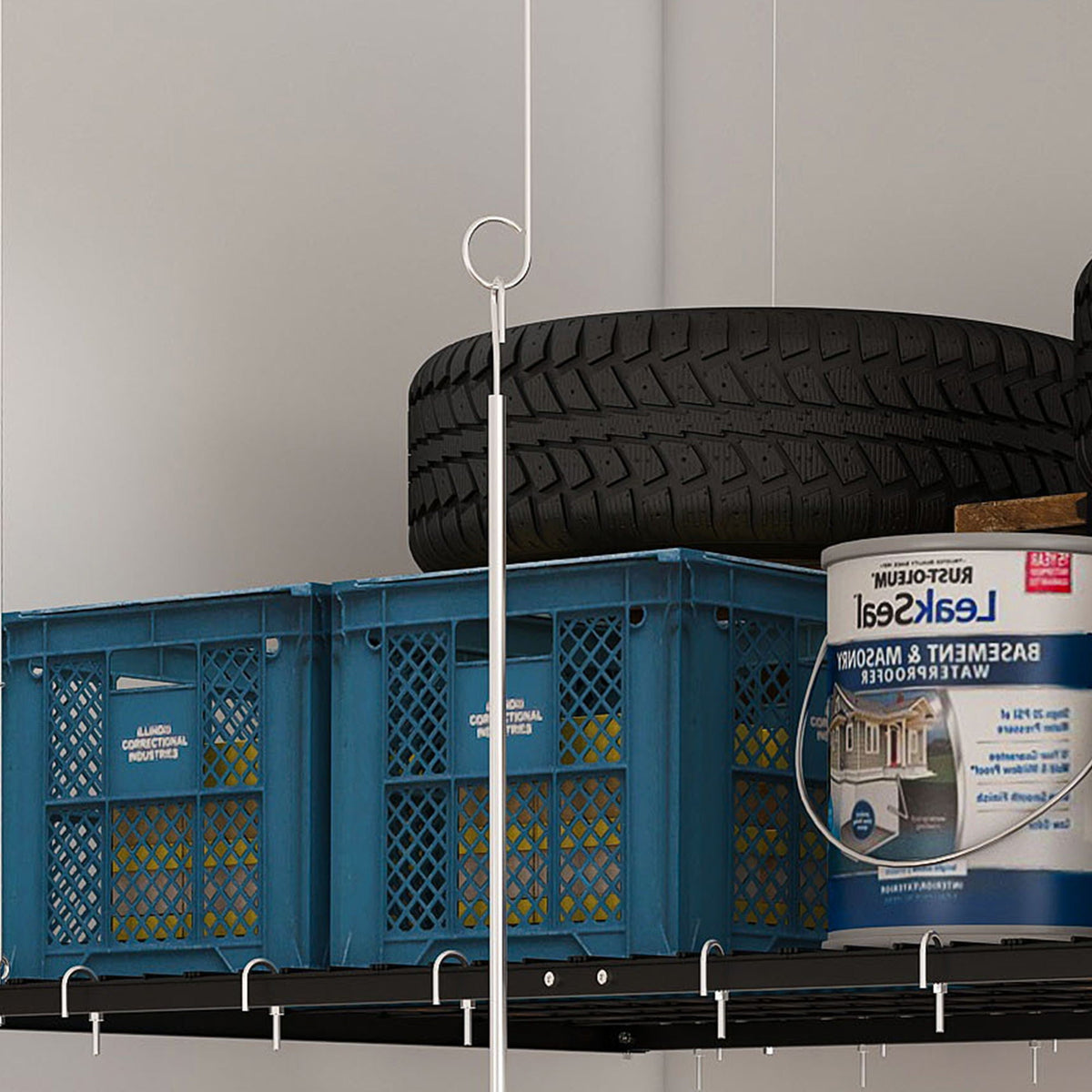 Overhead Garage Storage Rack with Crank System by HouseOfZazla in garage, holding a tire and crates on Tampa Home & Garden Store