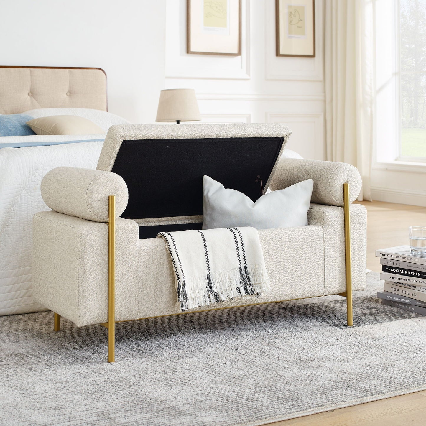 Elegant upholstered storage bench with cylindrical arms and gold iron legs in beige fabric on Tampa Home & Garden Store