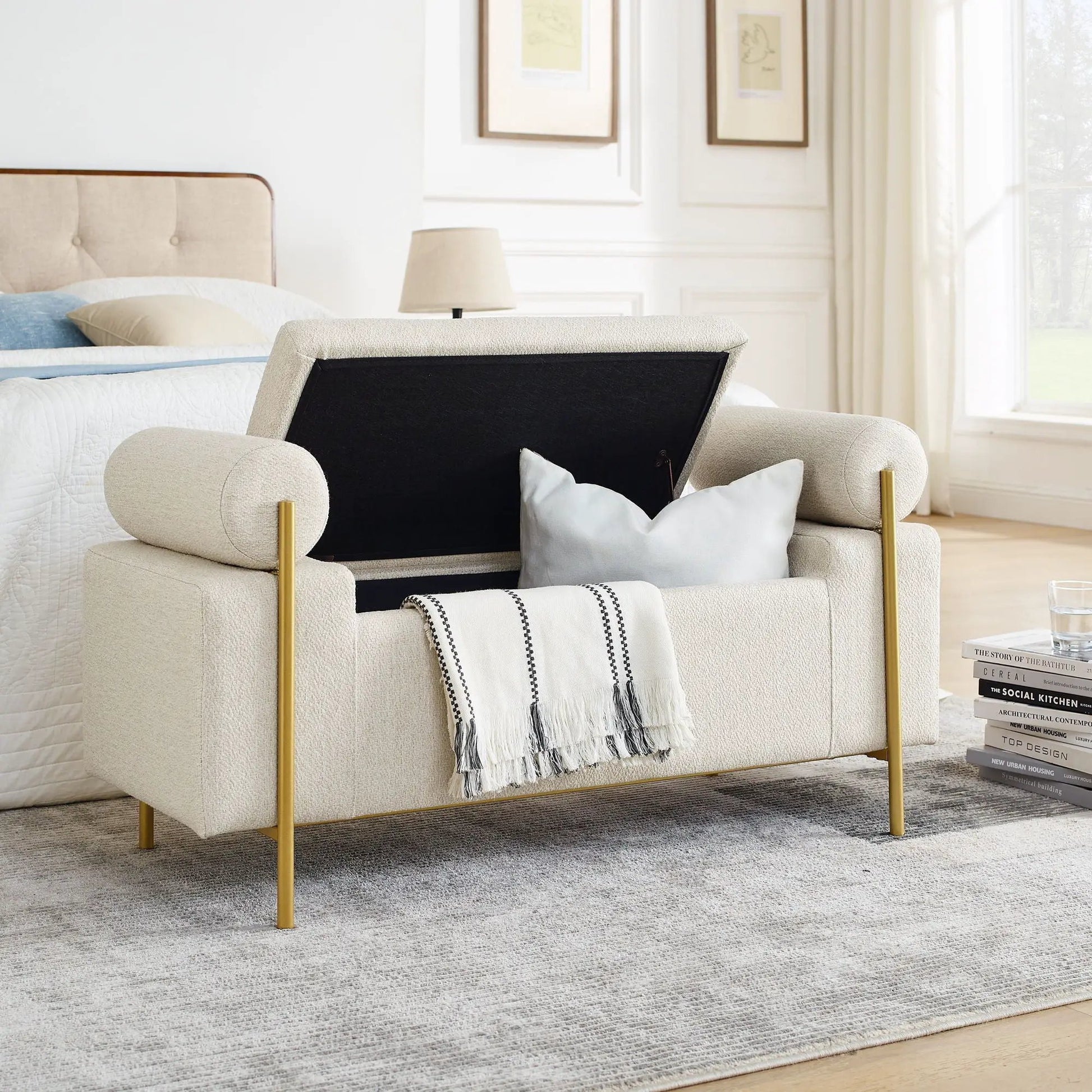Elegant upholstered storage bench with cylindrical arms and gold iron legs in beige fabric on Tampa Home & Garden Store
