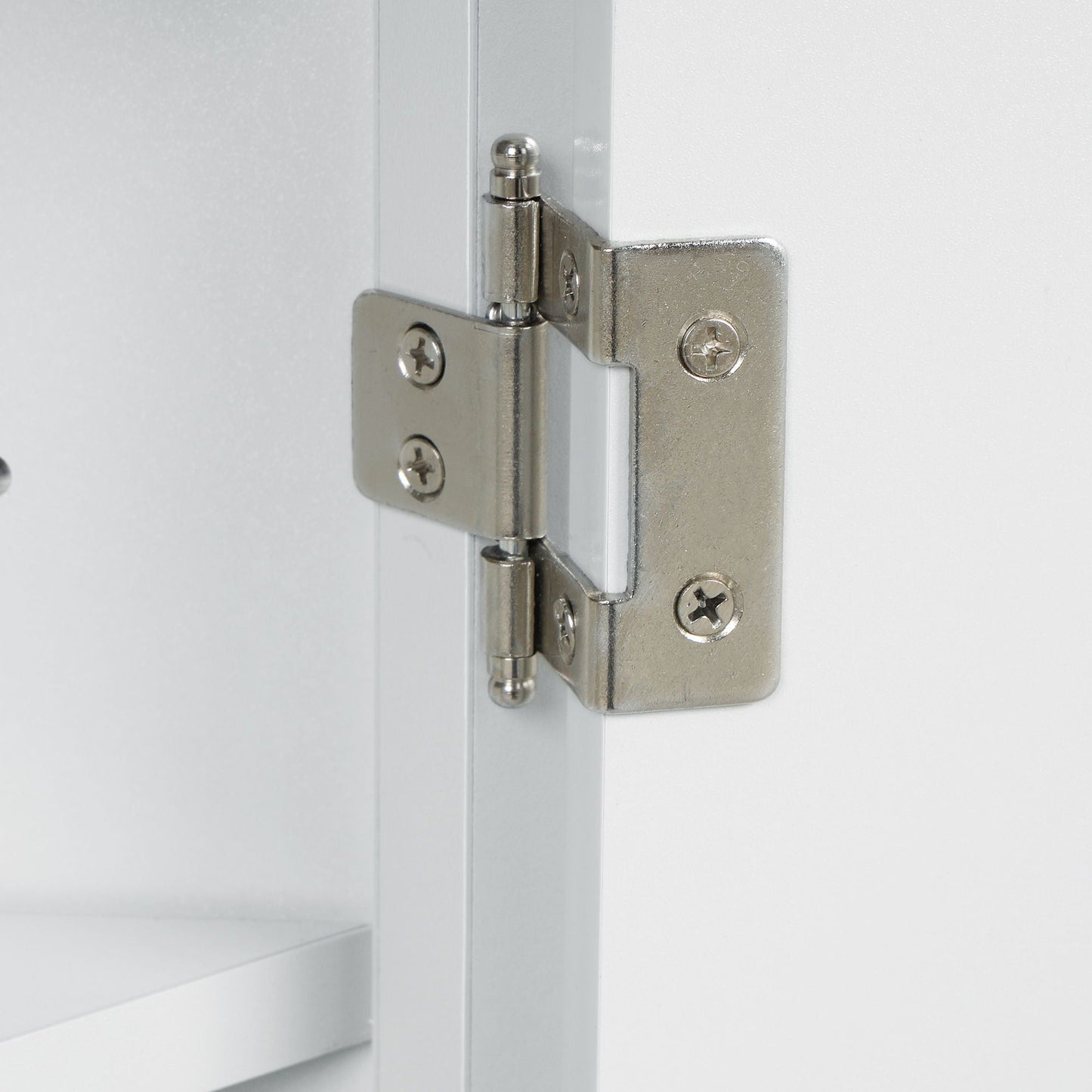 White linen cabinet hinge close-up with silver metal hinge and screws on Tampa Home & Garden Store