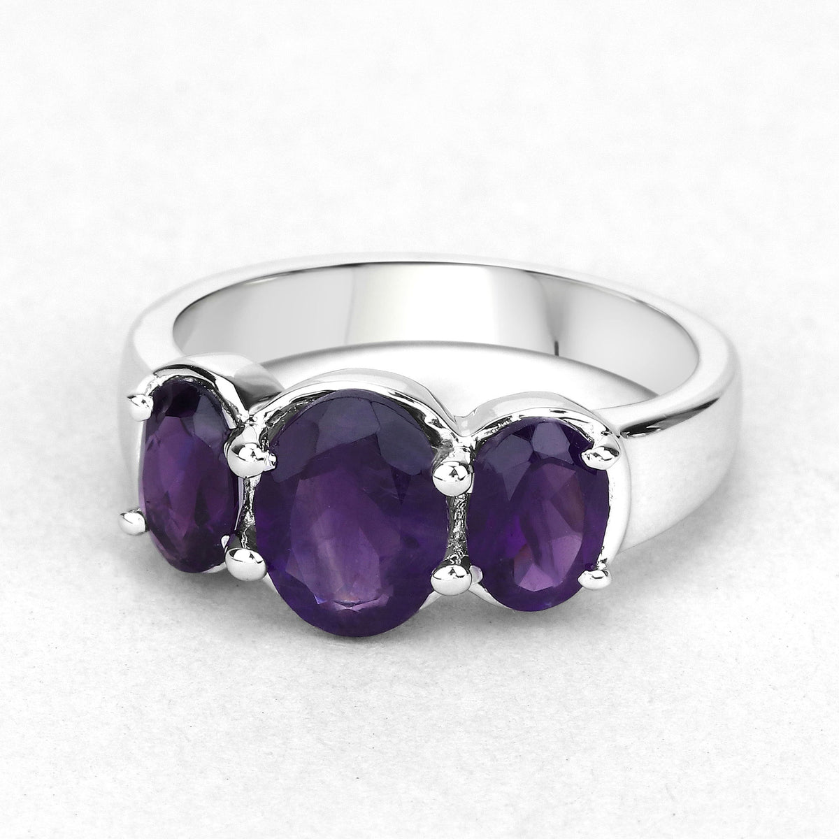 Three-stone amethyst sterling silver ring with purple gems in prong settings on band on Tampa Home & Garden Store