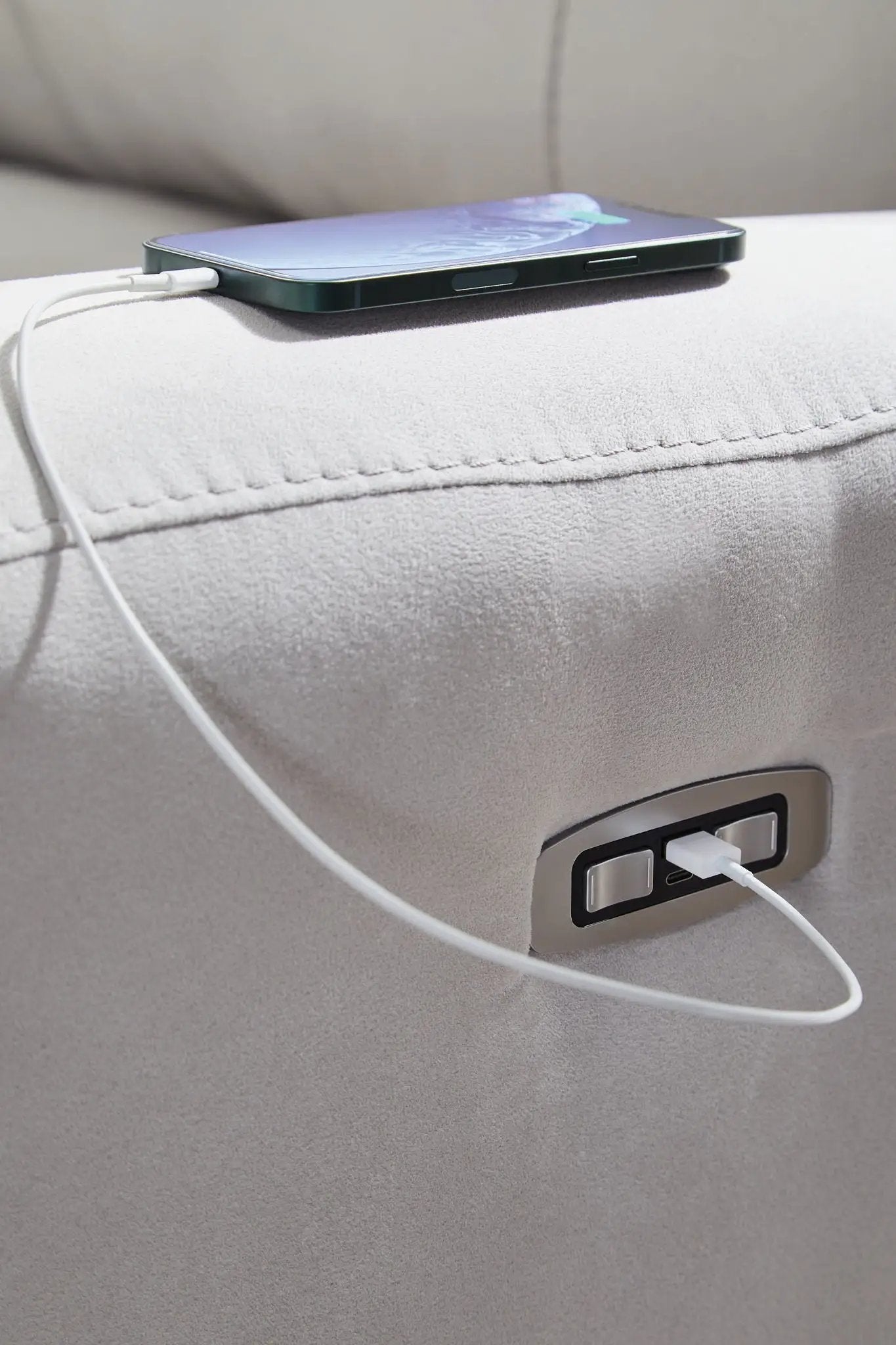 Social Pointe Reclining Sectional armrest in light gray fabric with charging cable on Tampa Home & Garden Store