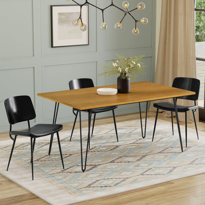 Square mango wood dining table with hairpin legs in a modern dining room with black chairs on Tampa Home & Garden Store