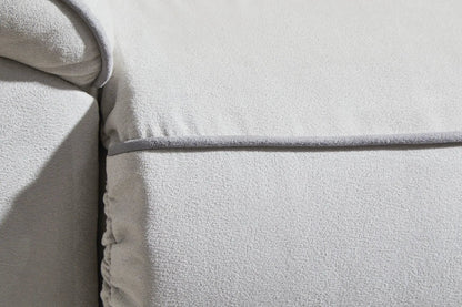 Social Pointe reclining sectional close-up in light gray textured upholstery with piping on Tampa Home & Garden Store