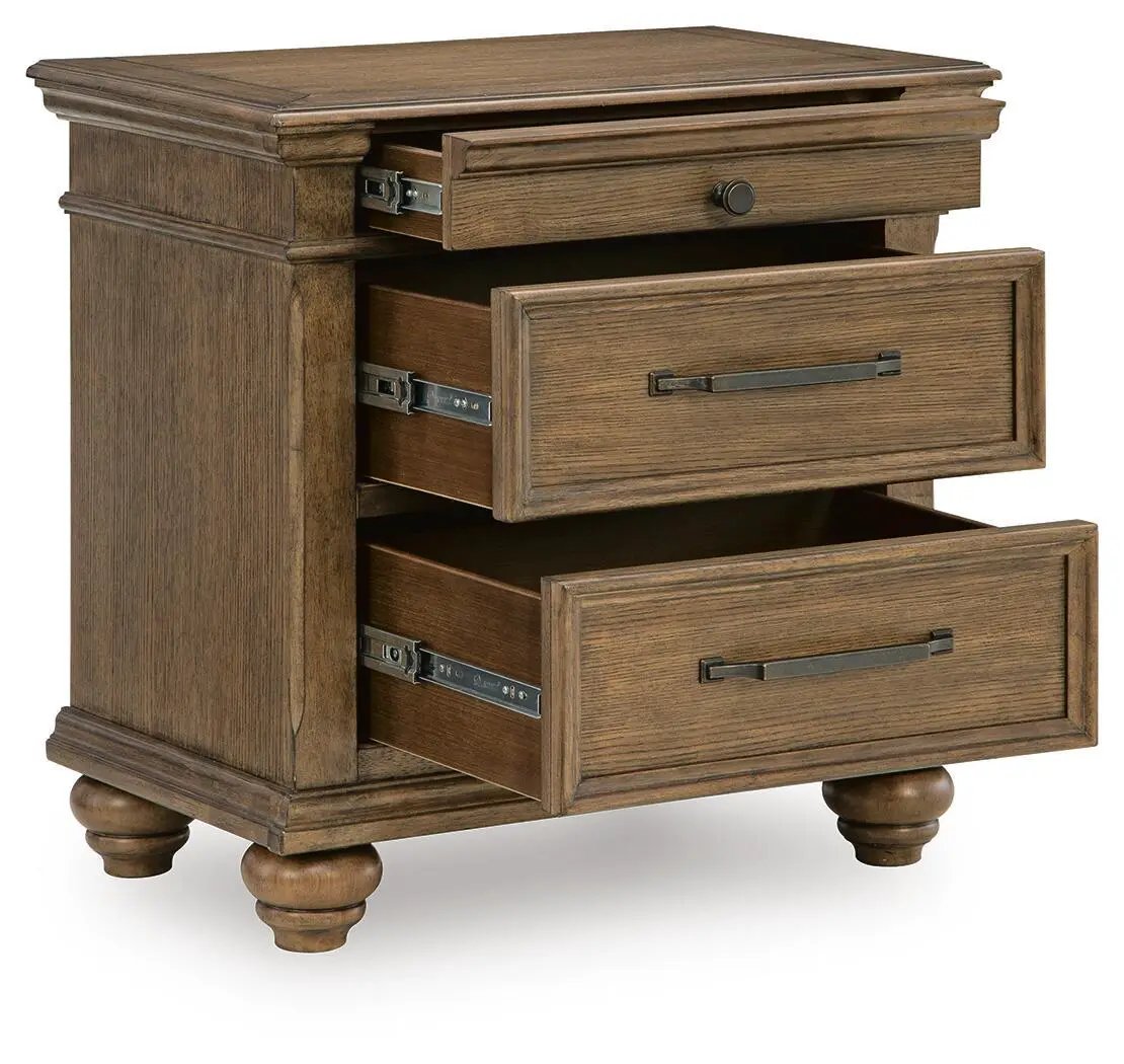 Karallin three-drawer nightstand in medium brown wood with dark metal pulls and bun feet on Tampa Home & Garden Store