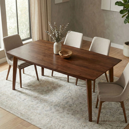 Rectangular dining table in dark brown wood with four beige upholstered chairs on Tampa Home & Garden Store