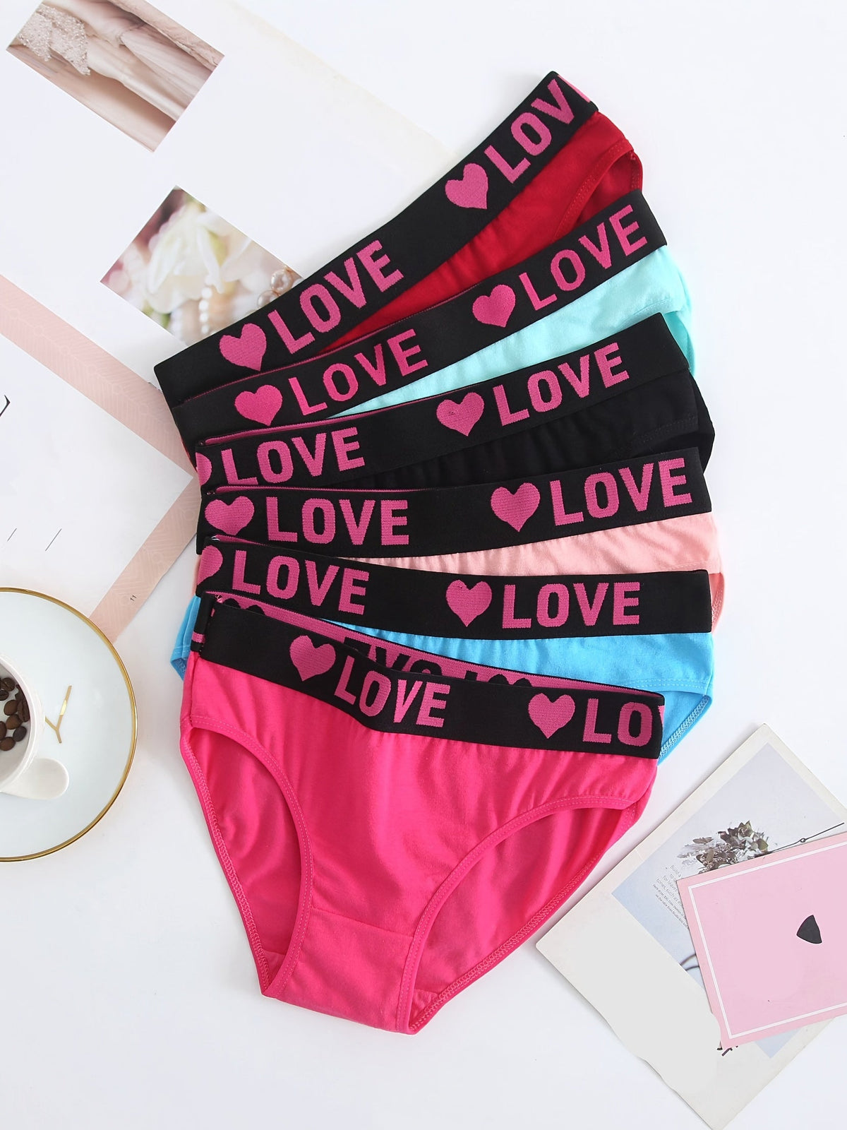 Six-pack soft-touch seamless bikini briefs in assorted colors with pink LOVE heart waistband on Tampa Home & Garden Store