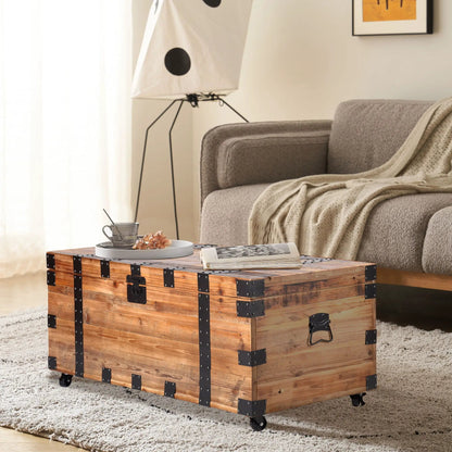 Trunk coffee table in natural wood with black metal hardware, caster wheels and storage on Tampa Home & Garden Store