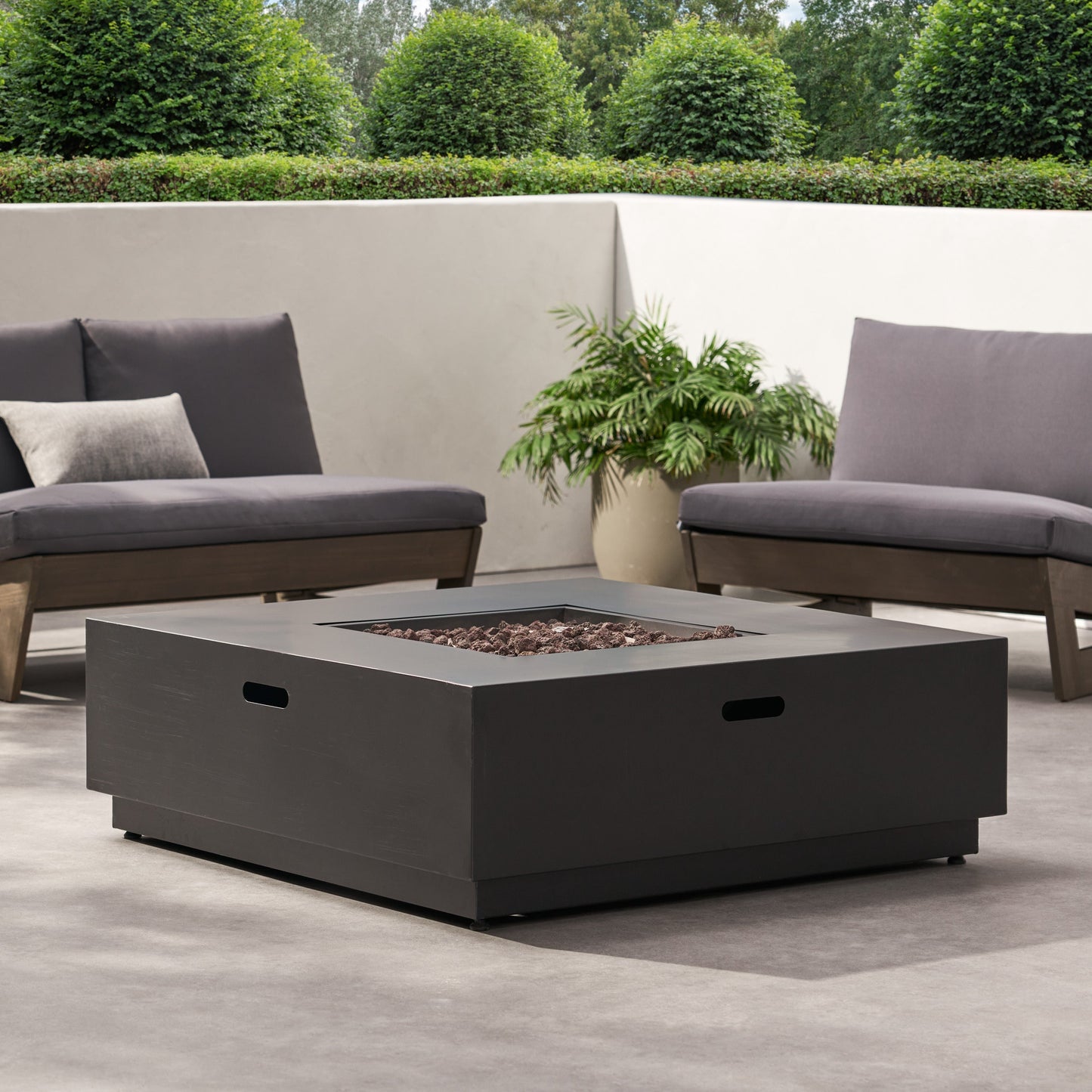 39-inch square iron fire pit with lava rocks in a modern outdoor lounge setting on Tampa Home & Garden Store