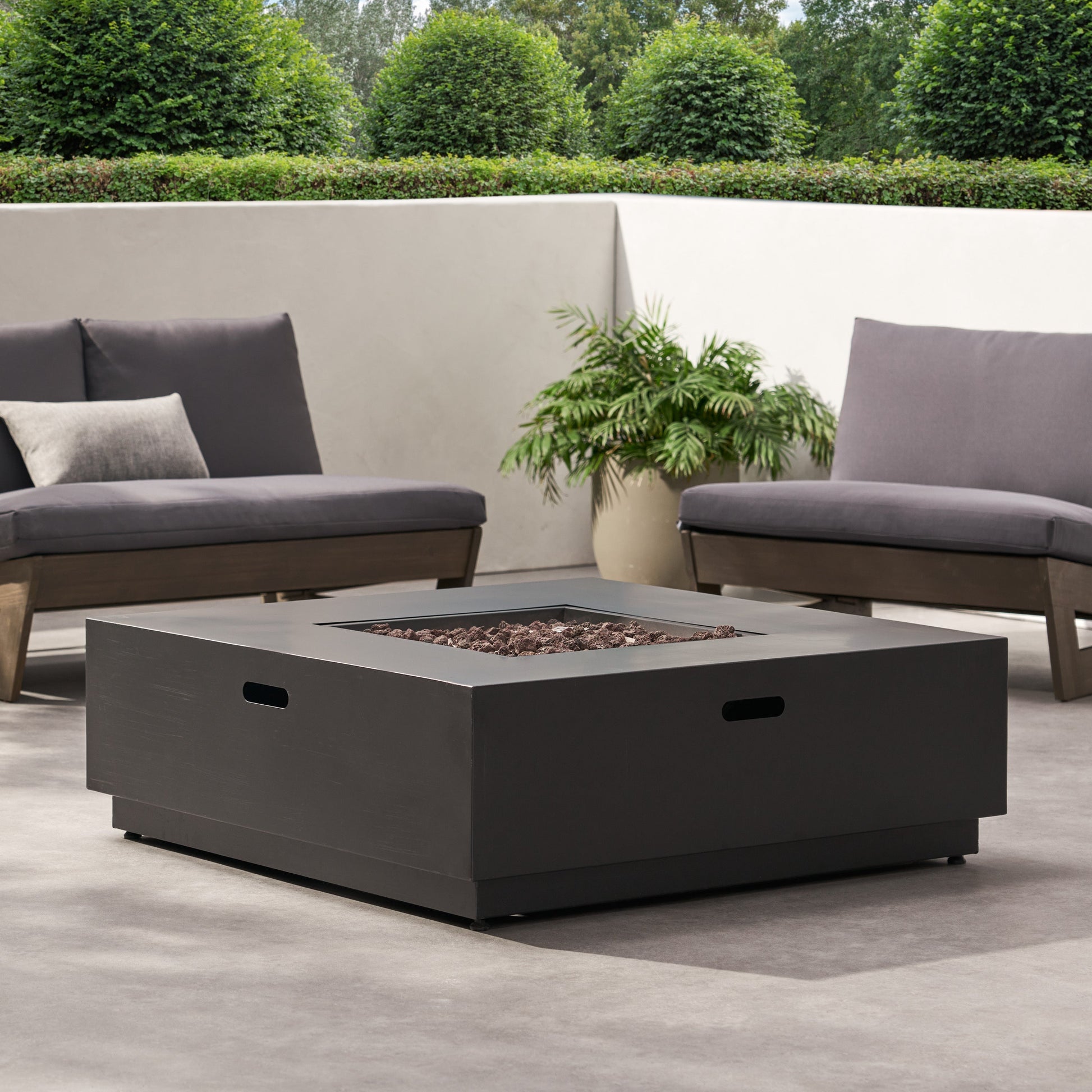 39-inch square iron fire pit with lava rocks in a modern outdoor lounge setting on Tampa Home & Garden Store