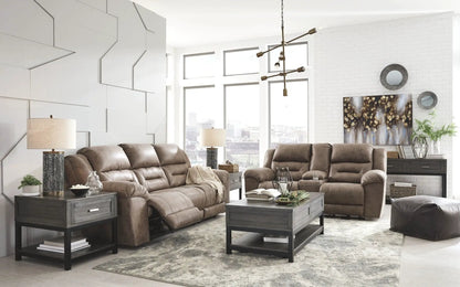 Stoneland reclining living room set two brown leather sofas with dark wood end tables on Tampa Home & Garden Store