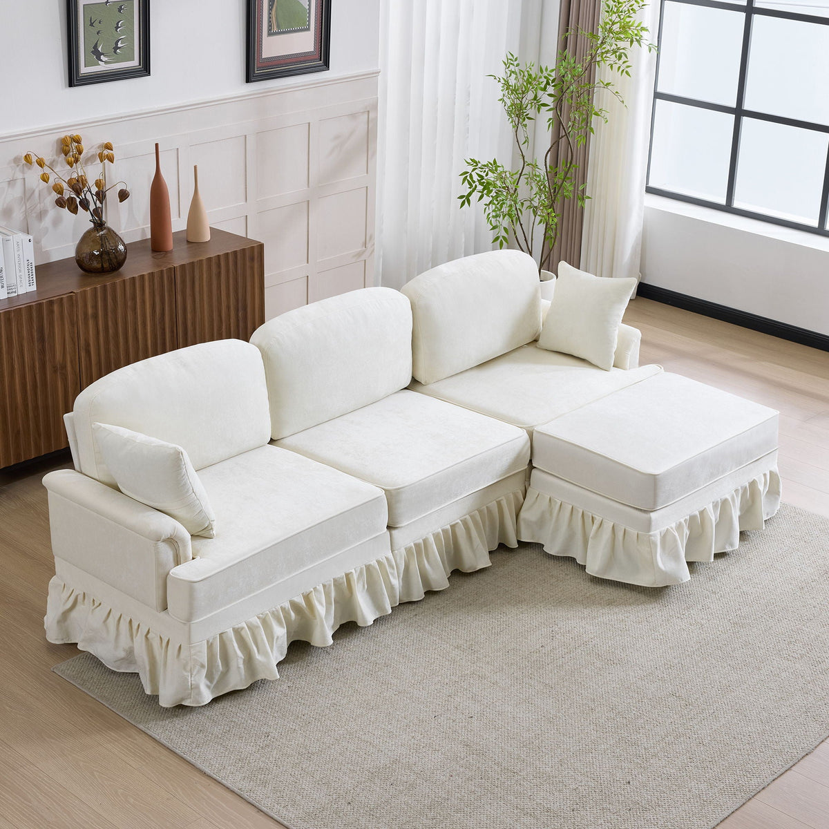 White L-shaped 2pc sectional with removable ruffled skirt and ottoman in a bright living room on Tampa Home & Garden Store