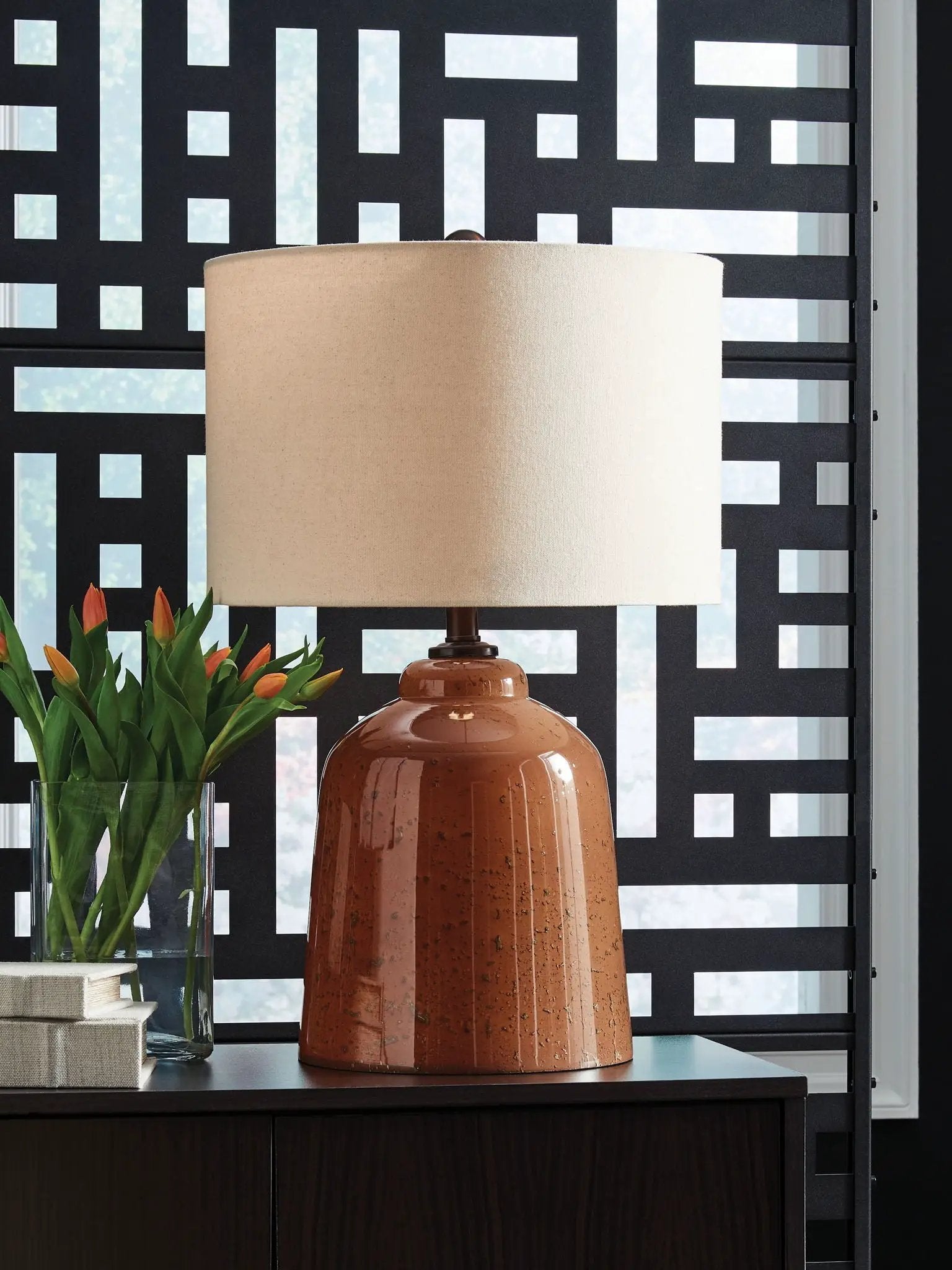 Aaleahya glass table lamp rust ceramic base with beige shade on dark wood surface on Tampa Home & Garden Store