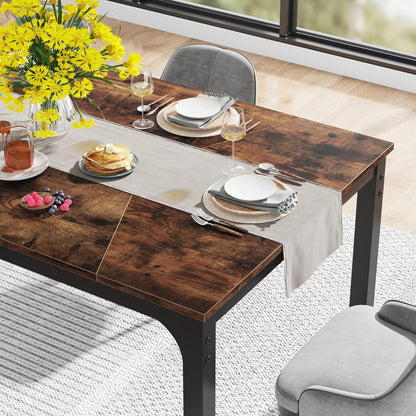 Rectangular dining table in brown wood with black legs, HouseOfZazla, set with plates, yellow floral centerpiece on Tampa Home & Garden Store
