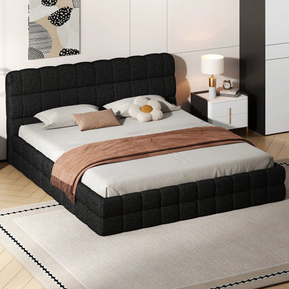Upholstered platform bed with tufted headboard in dark charcoal fabric with beige bedding on Tampa Home & Garden Store