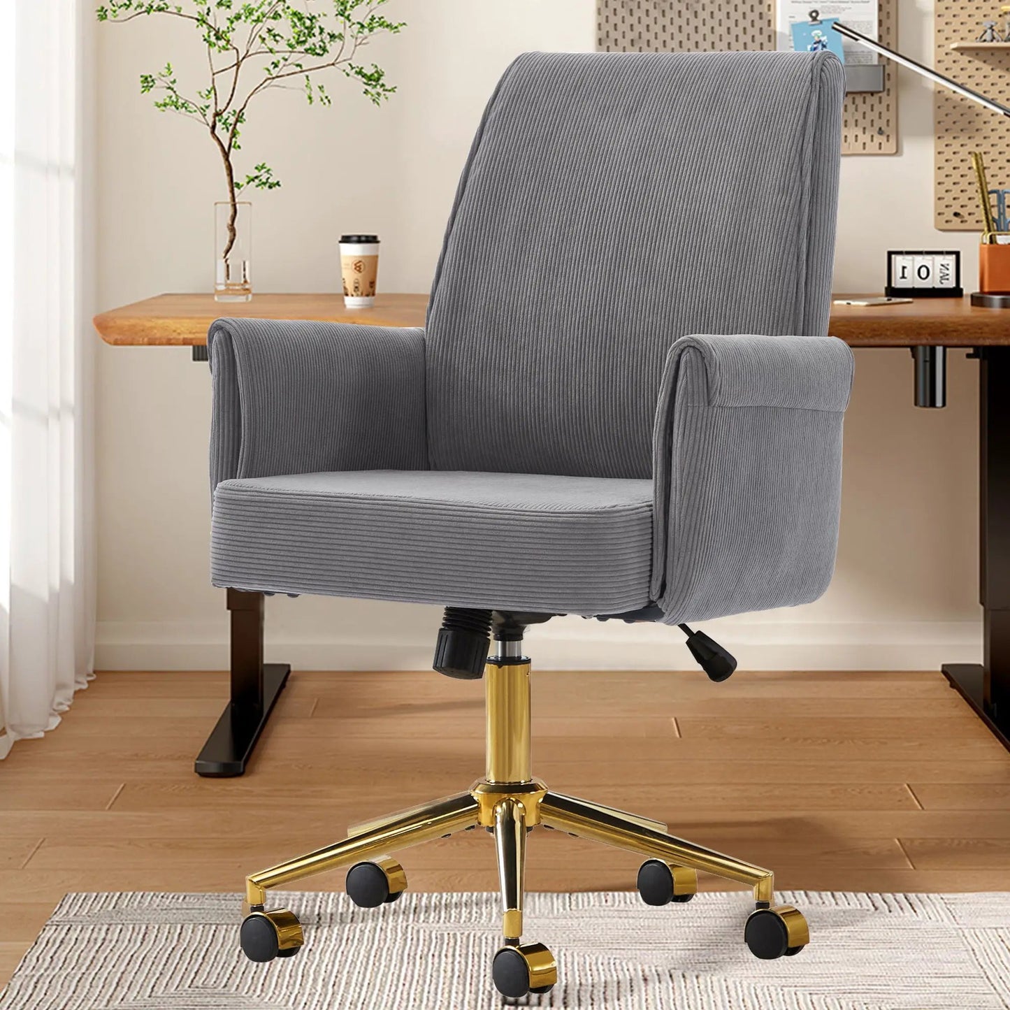 Ergonomic Mid Back Office Chair in grey ribbed fabric with a gold base and 5 casters in a home office on Tampa Home & Garden Store
