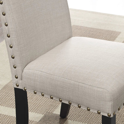 Mytzi 5 Piece Dining Set tan upholstery chair close-up with nailhead trim and black legs on Tampa Home & Garden Store