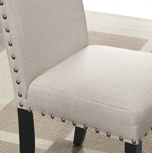 Mytzi 5 Piece Dining Set tan upholstery chair close-up with nailhead trim and black legs on Tampa Home & Garden Store