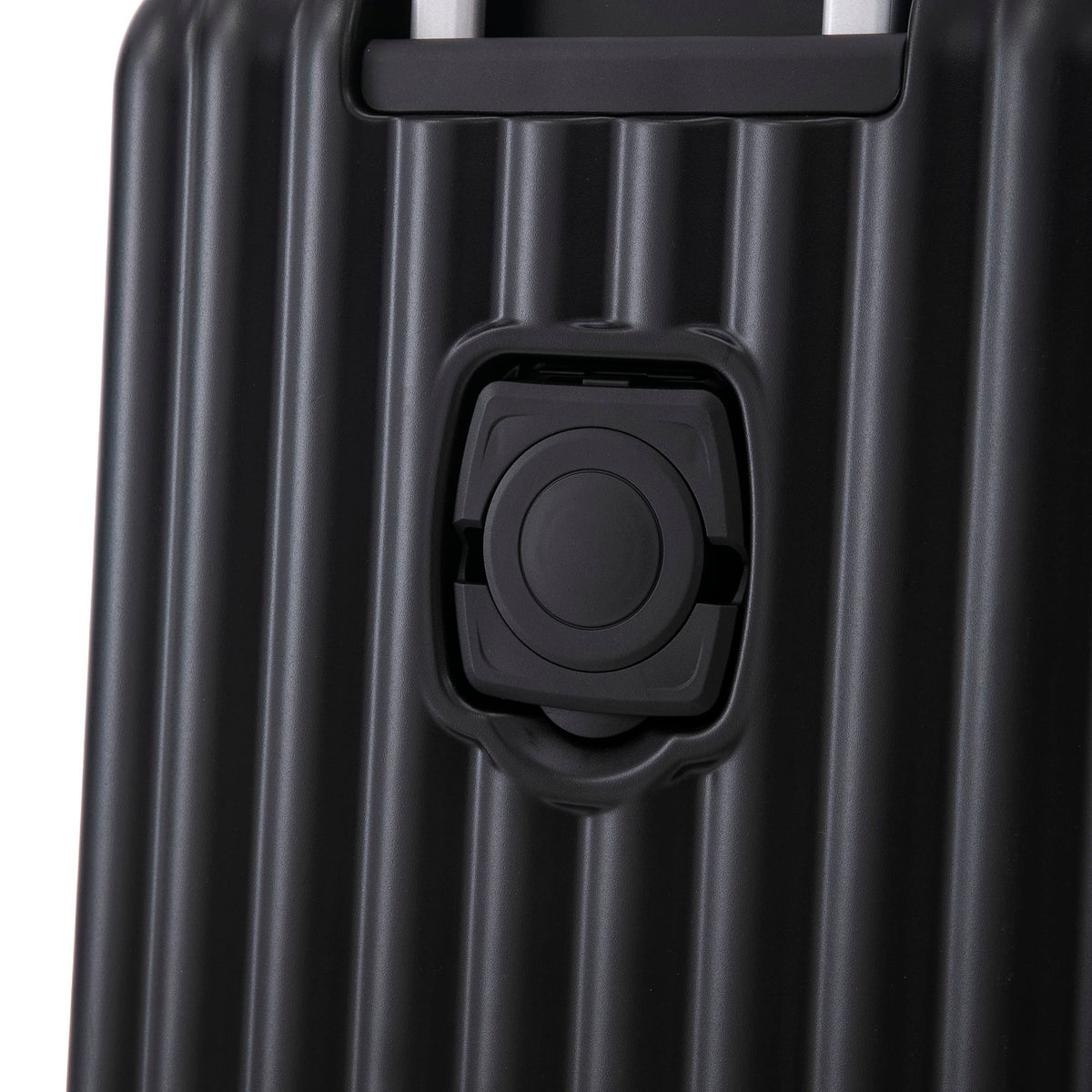 Black hard-shell luggage close-up showing spinner wheel housing and retractable handle on Tampa Home & Garden Store