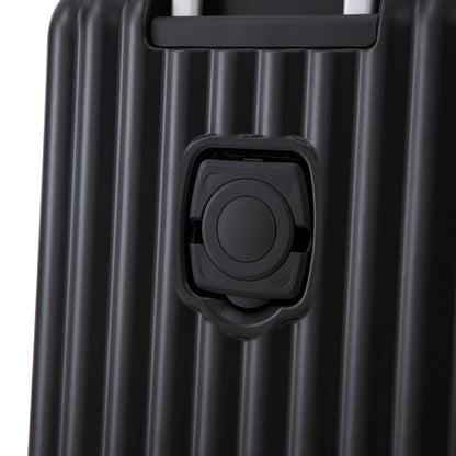 Black hard-shell luggage close-up showing spinner wheel housing and retractable handle on Tampa Home & Garden Store