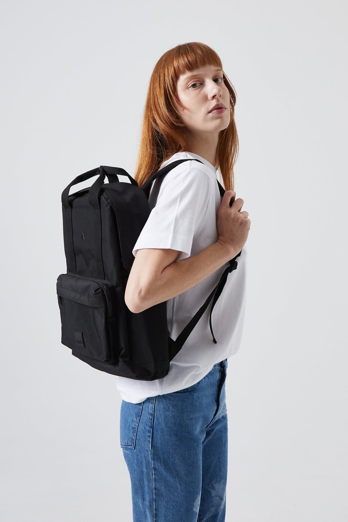 Capsule Backpack Black with Laptop Sleeve Lefrik USA worn on back by model on Tampa Home & Garden Store