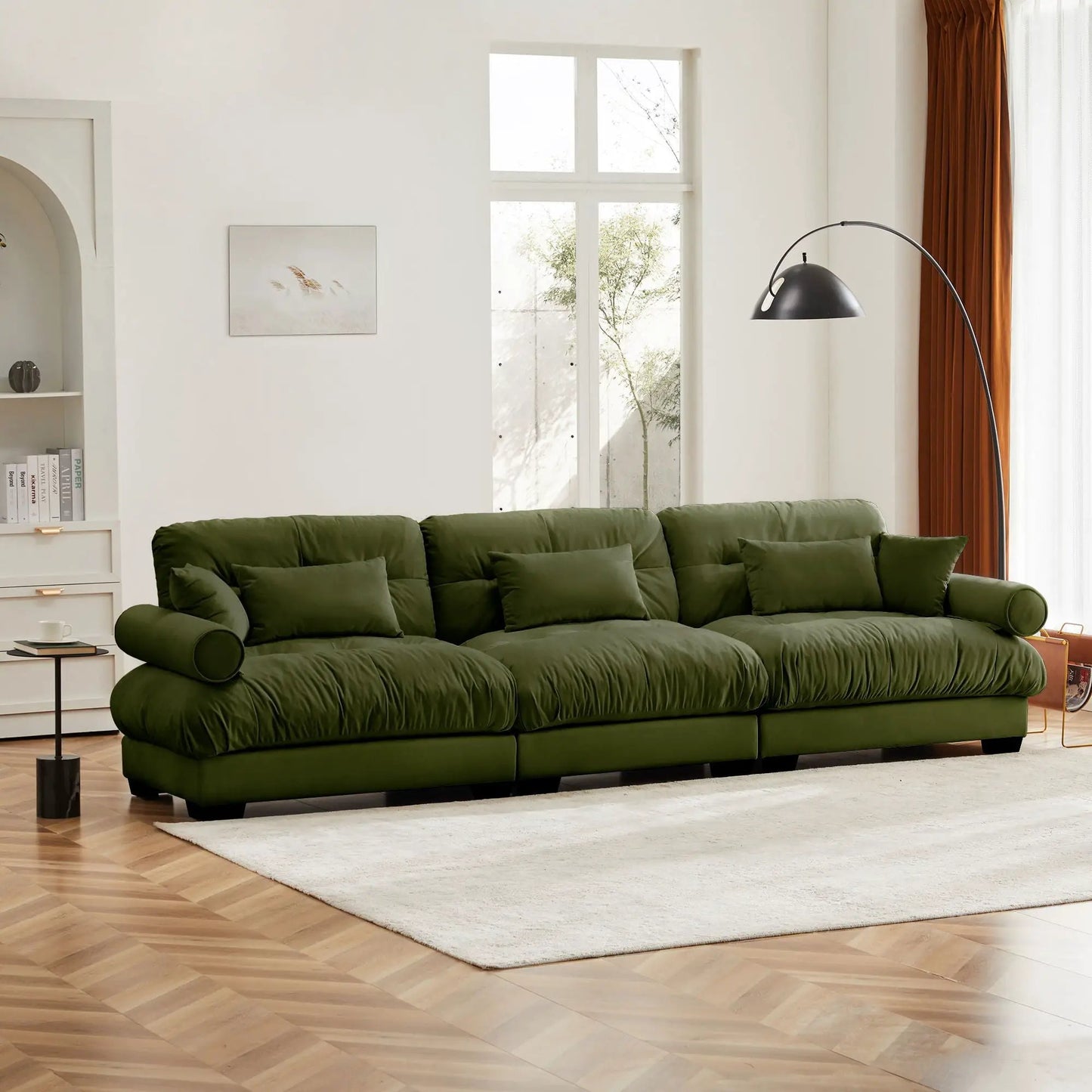 Modern stationary sofa with bolstered arms and pillows in olive-green fabric upholstery on Tampa Home & Garden Store