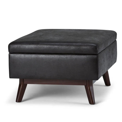 Owen upholstered rectangular storage ottoman in charcoal faux leather with wood legs on Tampa Home & Garden Store