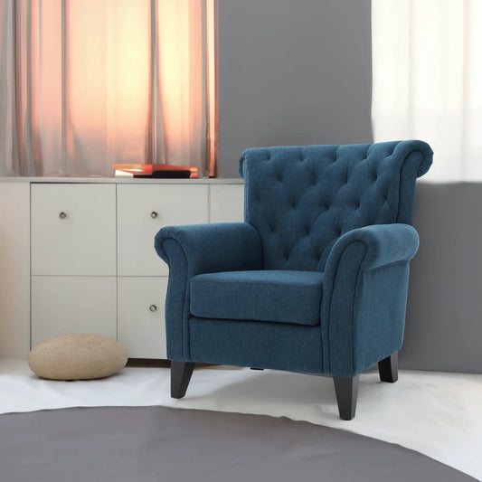 Springfield tufted navy fabric armchair with curved arms and dark legs in a modern room on Tampa Home & Garden Store