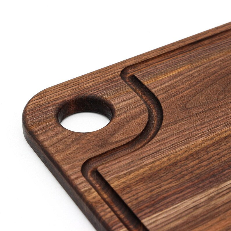 Thumb-hole cutting board in dark wood with rounded thumb hole, Refine Kitchenware cutting board on Tampa Home & Garden Store