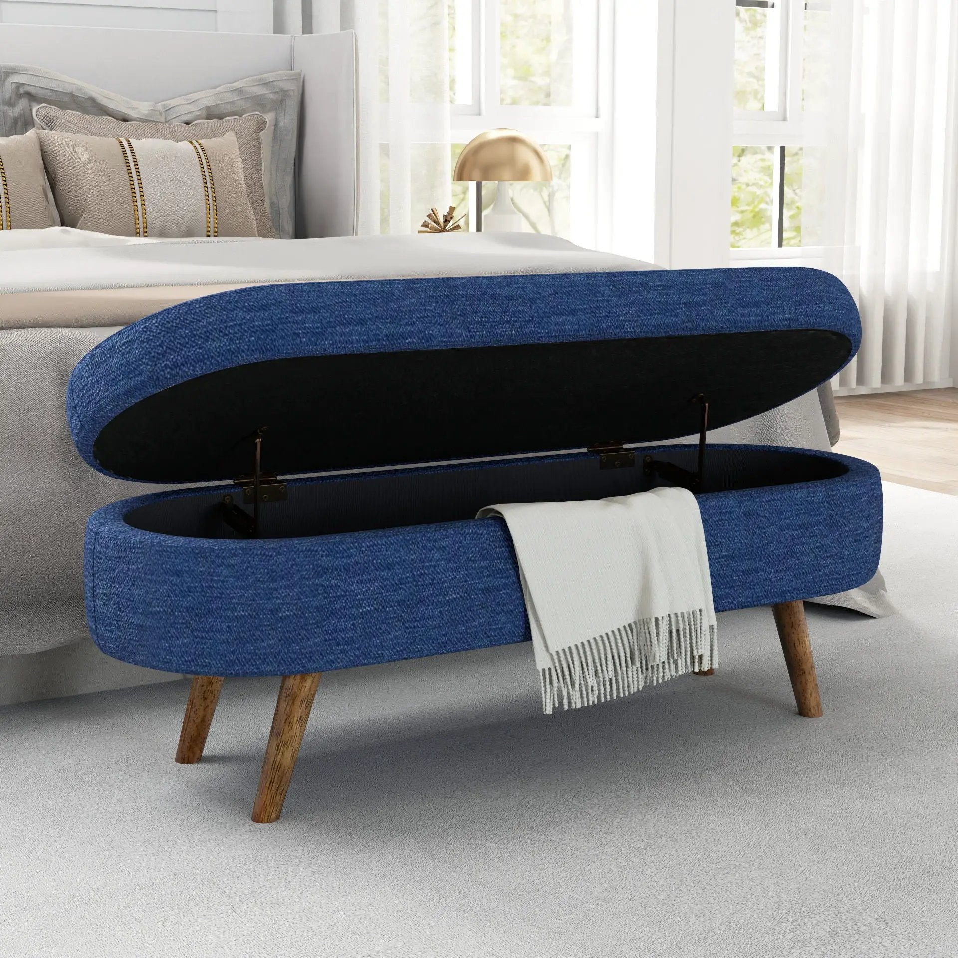 Ottoman oval storage bench in blue fabric with lift-top storage and rubber wood legs on Tampa Home & Garden Store