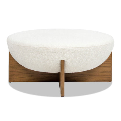 Round white boucle upholstered ottoman on a wooden platform base on Tampa Home & Garden Store