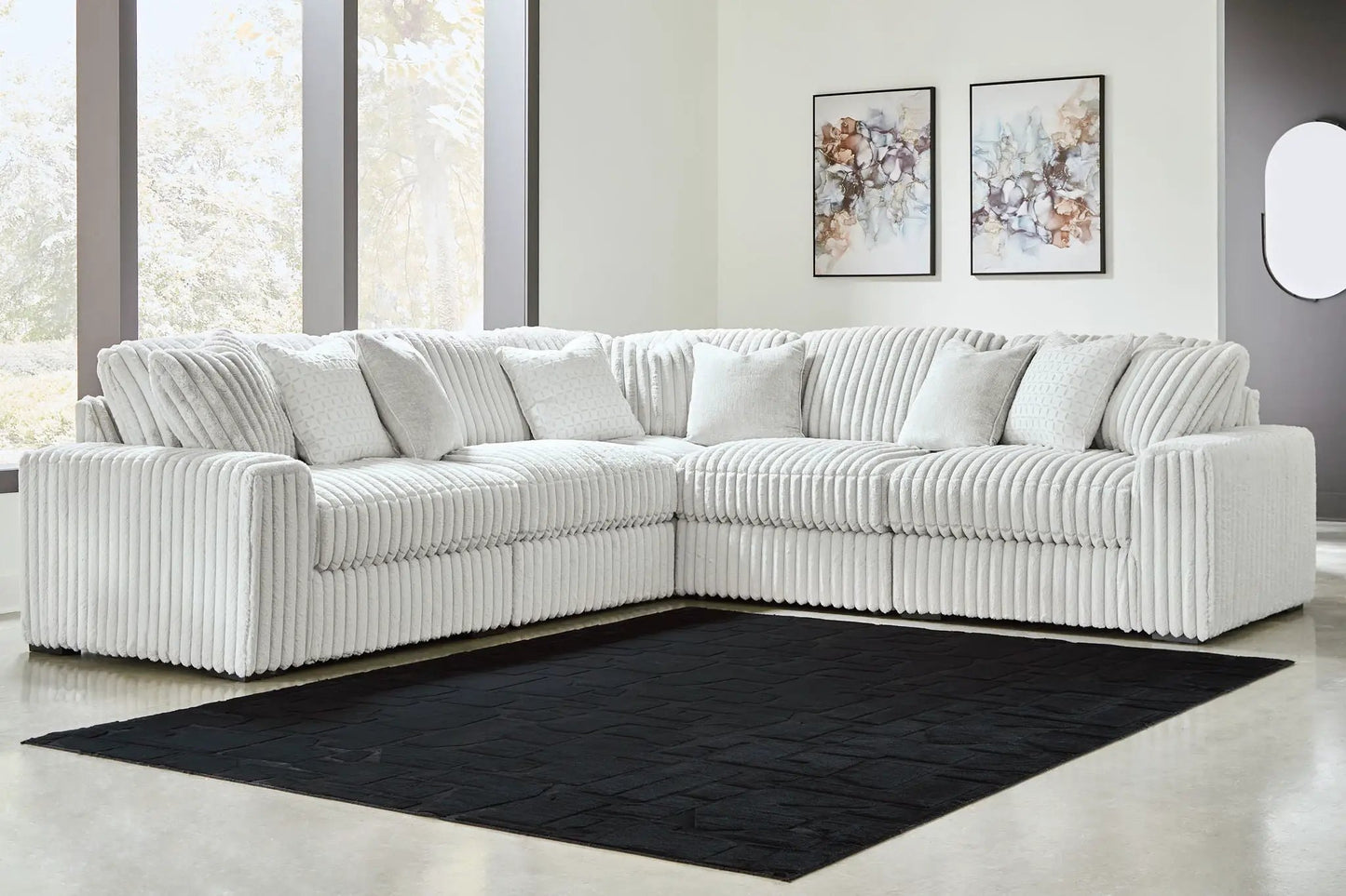 Stupendous - Sectional, white ribbed stationary sofa in an L with cushions on a black rug on Tampa Home & Garden Store
