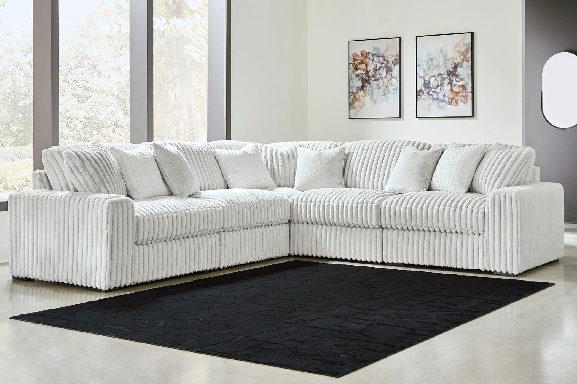 Stupendous - Sectional, white ribbed stationary sofa in an L with cushions on a black rug on Tampa Home & Garden Store