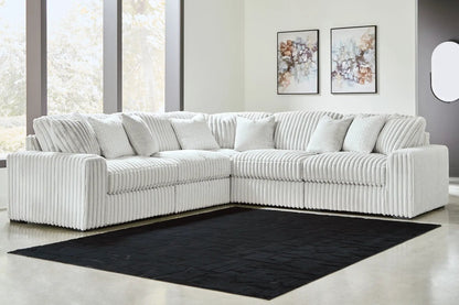 Stupendous - Sectional, white ribbed stationary sofa in an L with cushions on a black rug on Tampa Home & Garden Store
