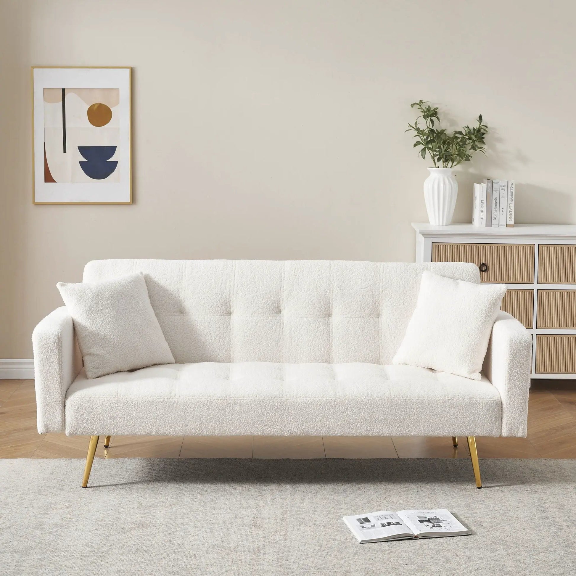 Teddy Fleece Sofa Bed with white plush upholstery and two decorative pillows in living room on Tampa Home & Garden Store