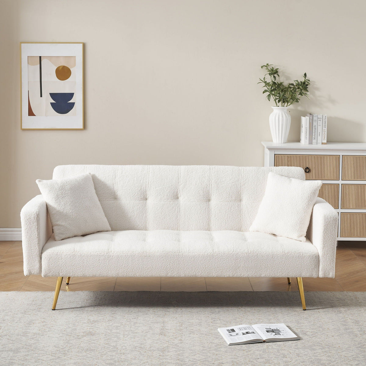 Teddy fleece futon sofa bed with two plush white pillows in white textured fabric on Tampa Home & Garden Store