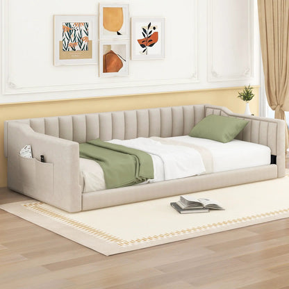 Beige upholstered daybed with side storage pocket and green pillows in a modern living room on Tampa Home & Garden Store