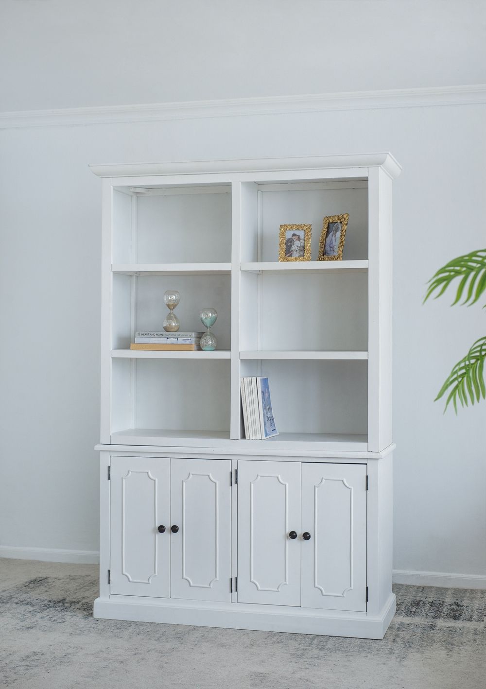 French Country white bookcase with open upper shelves and lower four-panel cabinet doors on Tampa Home & Garden Store