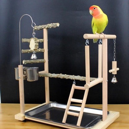 Wooden parrot stand with ladders, bells, cup feeder and perch on a metal tray base on Tampa Home & Garden Store