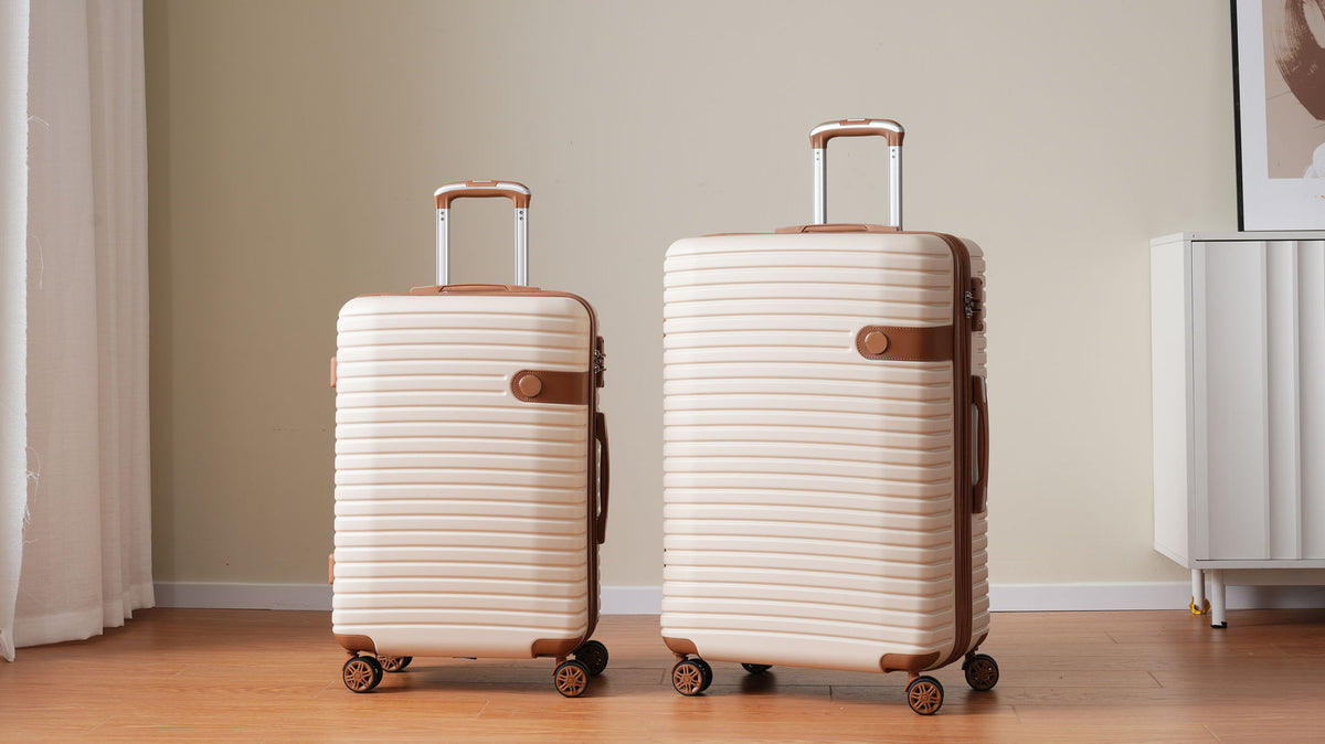 4 Piece Luggage Set champagne hard-shell suitcases with brown trim, 2 suitcases on wheels on Tampa Home & Garden Store