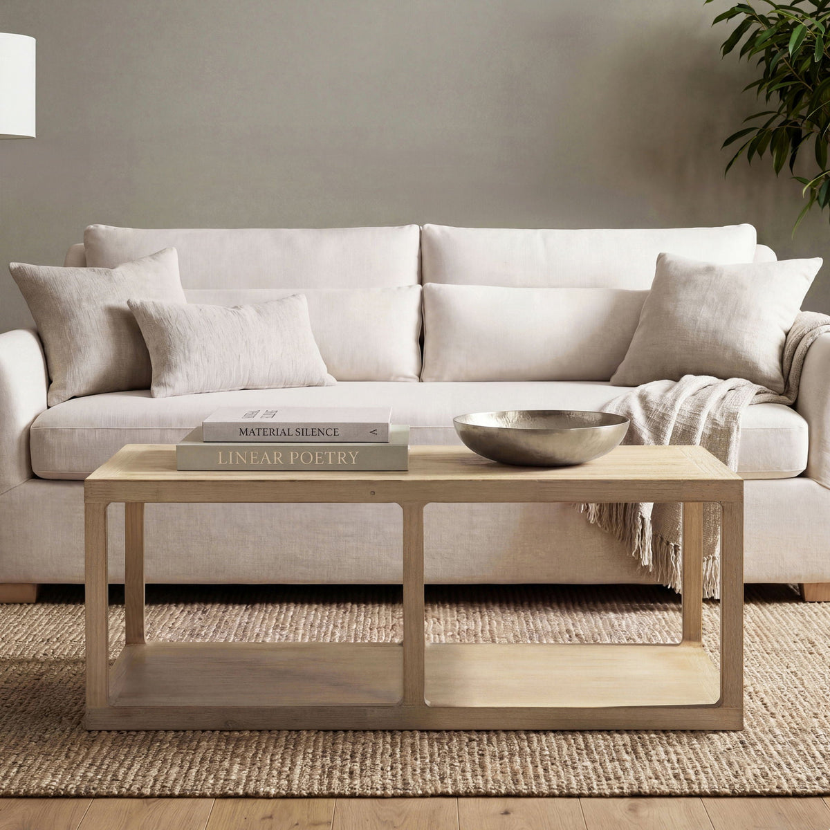 Natural reclaimed wood Ellis coffee table with lower shelf in a light-toned living room on Tampa Home & Garden Store