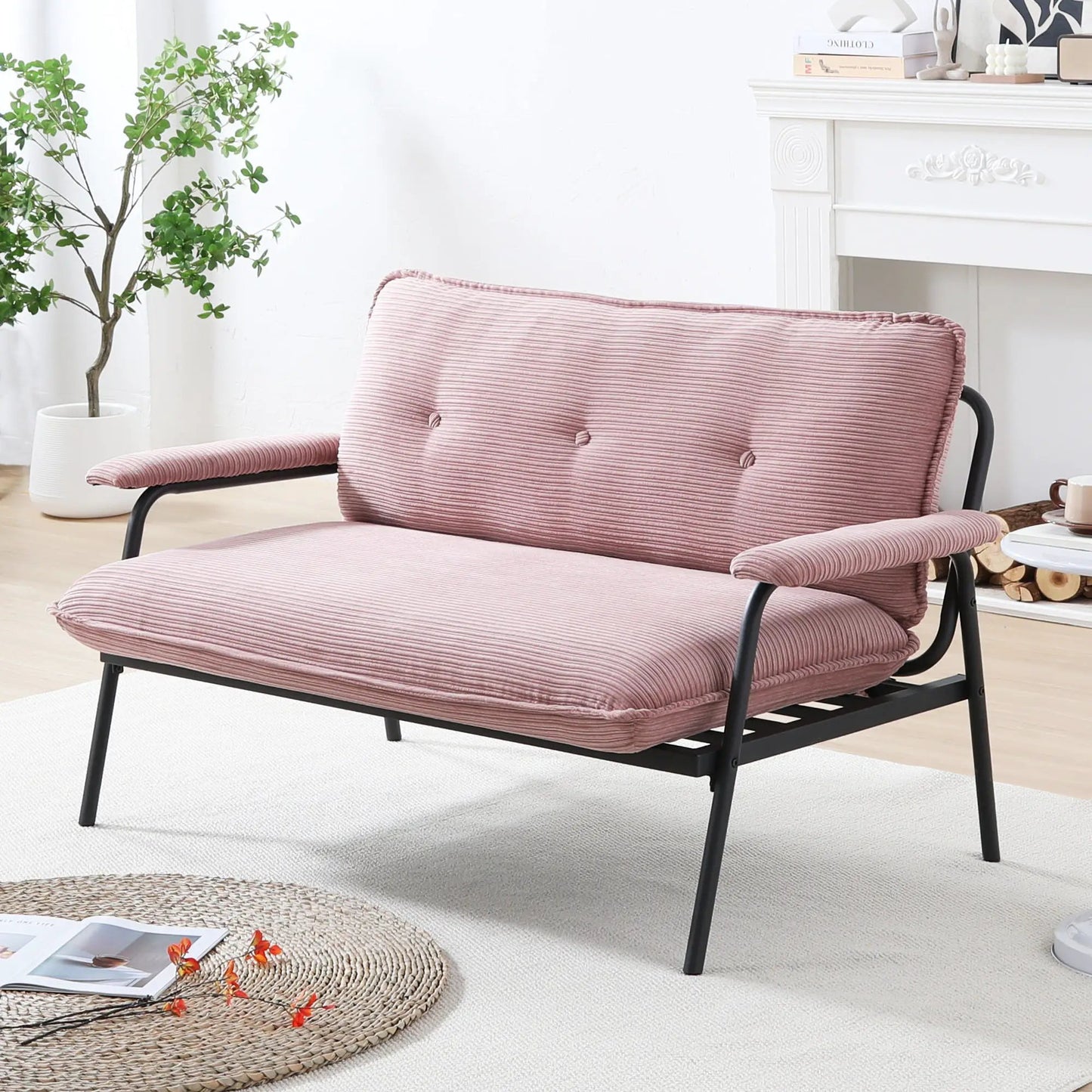 Pink ribbed sofa with black metal frame and sponge cushions compact stationary seating on Tampa Home & Garden Store