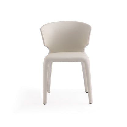 Conrad dining chair with beige upholstered seat and back and metal frame on Tampa Home & Garden Store