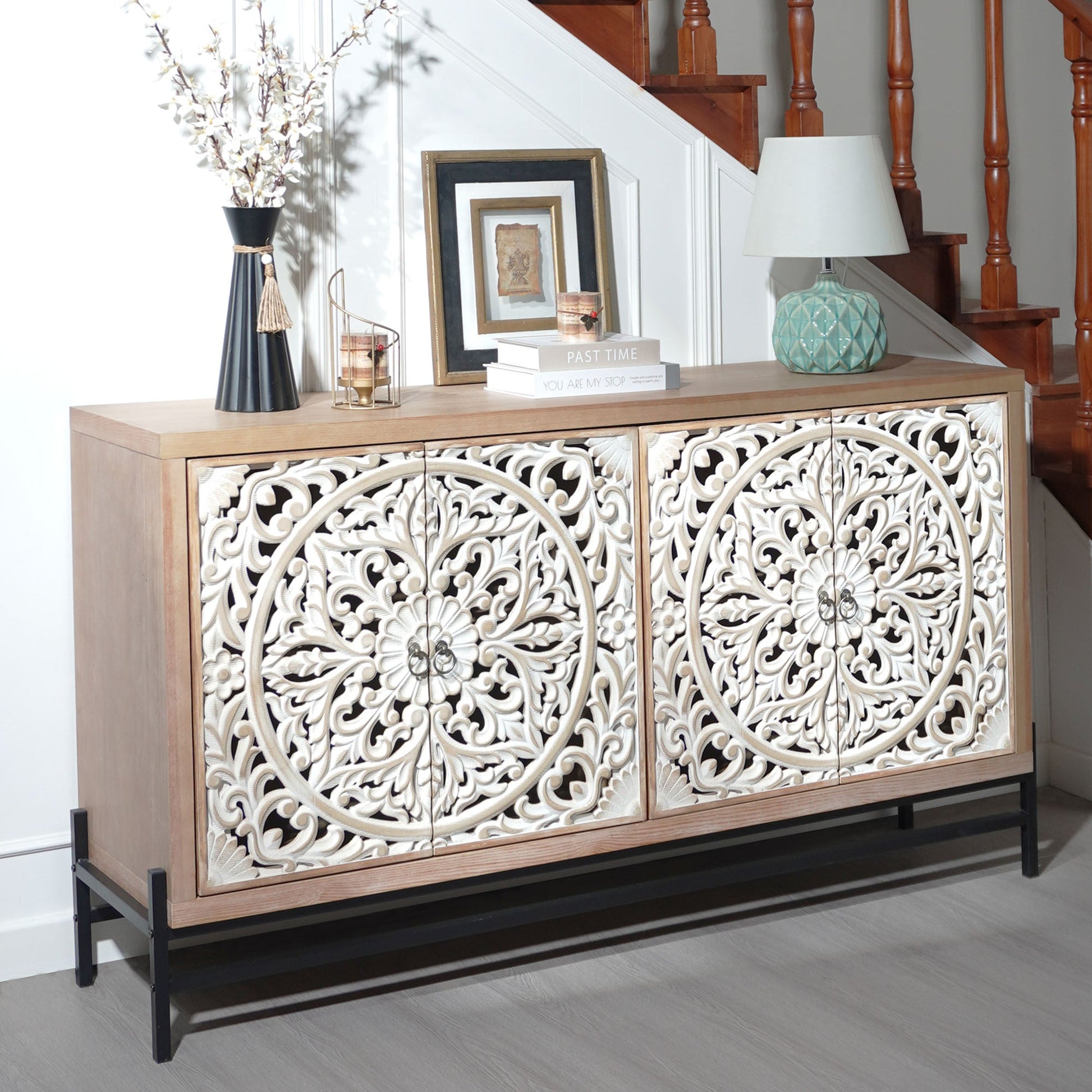 4-door wood cabinet with light oak finish, featuring vintage carved panels and metal base on Tampa Home & Garden Store