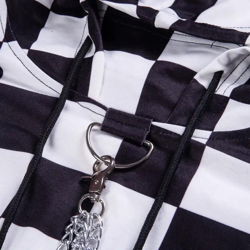 Dark black-and-white checkered blouse sweater with silver D-ring hardware and chain on Tampa Home & Garden Store