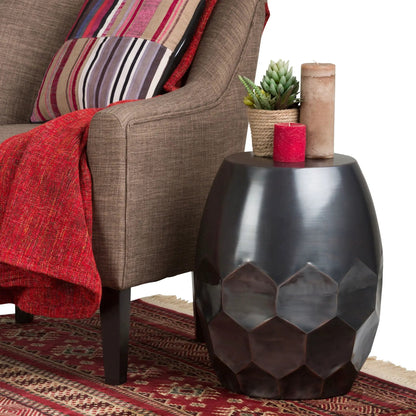 Flanigan Hand Crafted Metal Accent Table with bronze finish and faceted base beside chair on Tampa Home & Garden Store