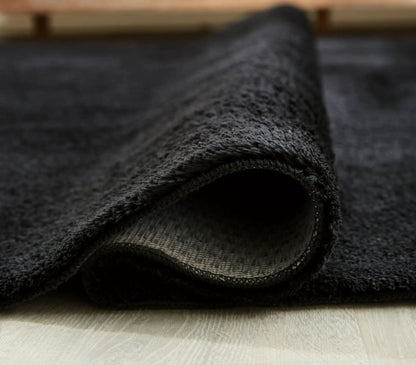 Anaben rug charcoal black washable rug with plush pile and stitched edge folded corner on Tampa Home & Garden Store